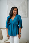 Storied Moments Draped Peplum Top In Teal Womens