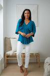 Storied Moments Draped Peplum Top In Teal Womens