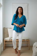 Storied Moments Draped Peplum Top In Teal Womens