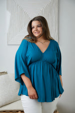 Storied Moments Draped Peplum Top In Teal Womens