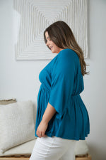 Storied Moments Draped Peplum Top In Teal Womens