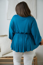 Storied Moments Draped Peplum Top In Teal Womens